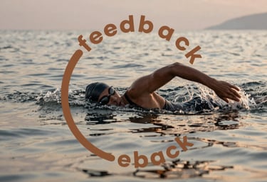 Swimmer training in open sea with calm waves under a golden sunrise.