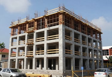 Close-up of industrial machinery and construction tools on a site, showcasing the Steel Blue and Soft Blue-Grey color palette.