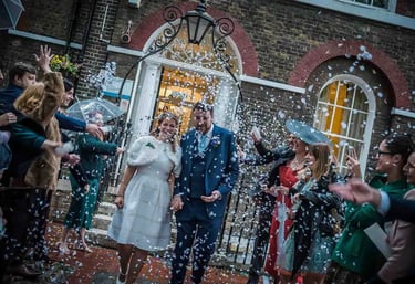 Newly weds walking through confetti at Southwark Registry Office