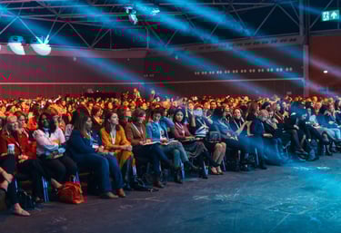 Large audience seated in a conference hall
