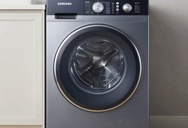 Technician repairing a washing machine inside a cozy Bogotá home.