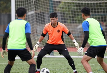 Close-up of a soccer training creator filming a drill with professional equipment.