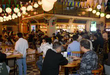 Guests enjoying cocktails, food, and live music at Filament Cocktail Bar in Pune.