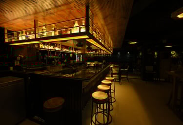 Interior of Filament Cocktail Bar Baner featuring modern bar design and ambient lighting.
