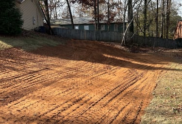 Filled area of yard to allow for proper drainage and a great lawn.