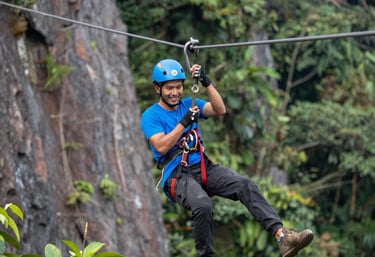 A scenic view of the resort nestled in lush greenery with ATV tracks winding through nature.
