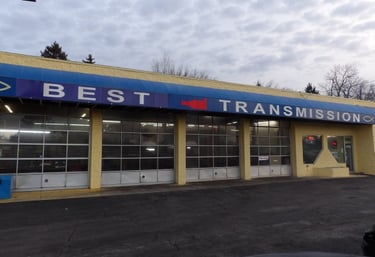 Exterior of Best Transmission auto repair shop showing service garage bays and office entrance.