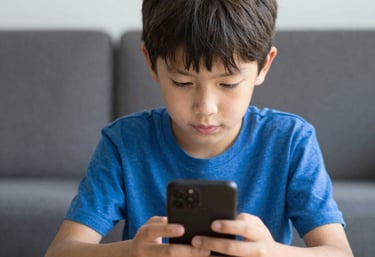 Colorful children happily engaged in hands-on learning activities at a bright table.