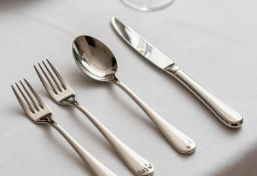 Close-up of a variety of kitchen utensils and cookware neatly arranged on display.