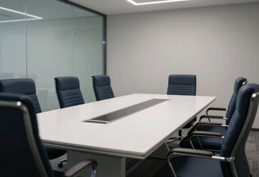 A high-tech meeting room with ergonomic chairs in dark navy and a polished white table, sharp focus, professional lighting.