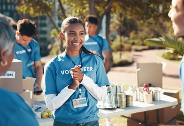 An image of a group of young teens volunteering in an event
