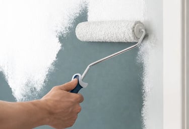 a professional painter is painting an interior  wall with a roller brush