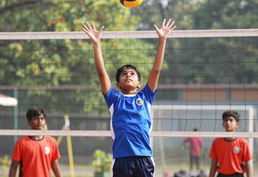 A warm, candid shot of village youth playing cricket during a local tournament under soft afternoon light.