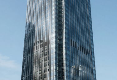 A minimalist view of a modern skyscraper's glass facade reflecting a clear blue sky in a major North American business hub, symbolizing growth and scalability. Clean and professional aesthetic.