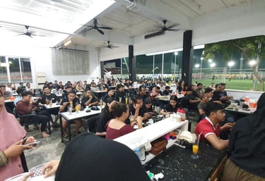 a group of people sitting at tables in a room