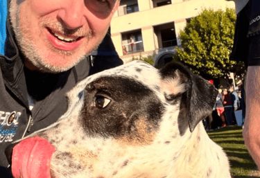 Carter Cathey original photo of Carter and dog Scout after a 5k.