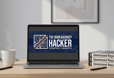 laptop on a desk with the bureaucracy hacker logo