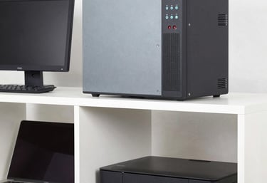 A friendly technician inspecting a used computer in a cozy workspace.