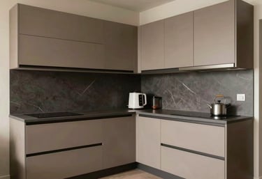 A sleek L-shaped modular kitchen with matte finish cabinets in earth tones and hidden handles, designed for a compact Pune apartment.