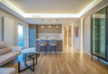 Nowoczesny salon z aneksem kuchennym, wyspą barową, krzesłami i oświetleniem LED