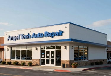 A daytime wide-angle shot of the Angel Tech Auto Repair building in a North American suburb. The facility is clean and modern, with professional blue signage.