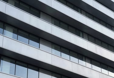 A minimalist, high-tech architectural detail of a modern building in North America, featuring clean lines, glass, and steel, symbolizing structure.