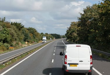 Operator using portable laser cleaning device on steel structure at construction site.