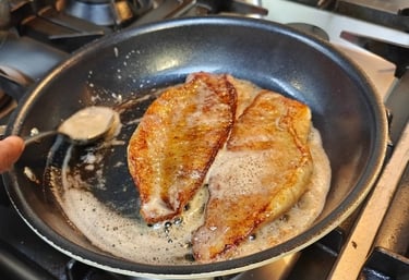 Studying the craft of cooking fish.