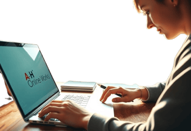 a man sitting at a desk with a laptop and a cell phone