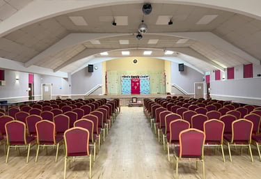 A picture of a hall fully setup for the music event