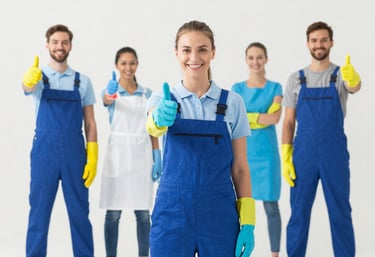 A minimalist and clean laundry room in a North American house. The appliances are sparkling white, and the shelves are perfectly organized, representing a masterfully cleaned and clutter-free utility space.