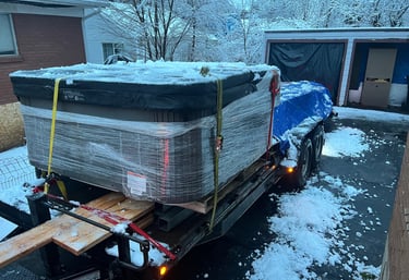 A hot tub on a trailer to be hauled away