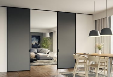 Puerta corredera acristalada con marco negro separando cocina y salón con diseño escandinavo