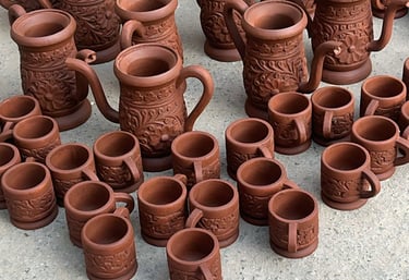 a bunch of wooden pots with a look of clay pots