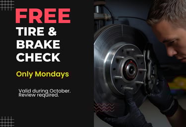 Mechanic checking car brakes during free tire and brake inspection Monday promotion at Fast Tire Sho