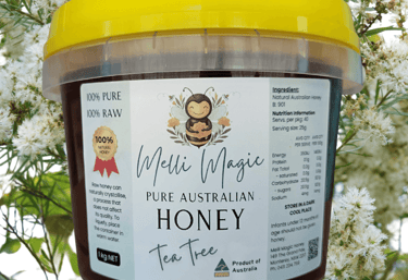 Melli Magic 1kg tub of pure Australian raw Australian Tea Tree honey with a yellow lid and bee logo.