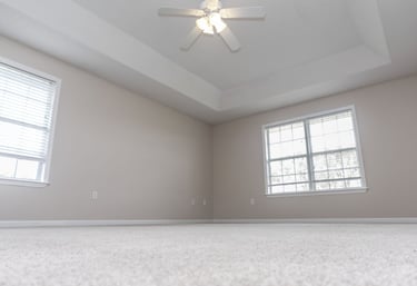 a ceiling fan in a room with a new ceiling