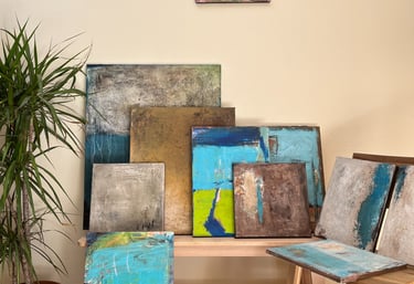 Different textured abstract paintings are staged