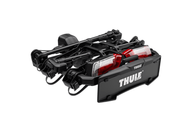 Thule bike rack folded for compact storage with integrated rear lights.