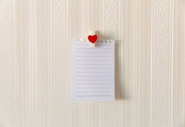 A blank note held by a heart clip