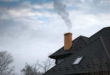 a chimney with newly installed cap and flashing