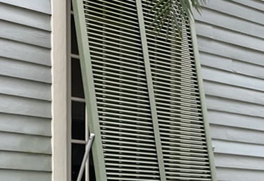 green bahama shutter on a house in new orleans