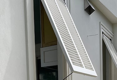 bahama shutters on an outdoor kitchen
