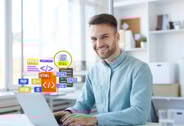 a man sitting at a table with a laptop and with web design icons 
