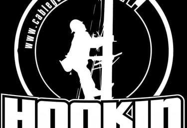 a man climbing a pole with the words hookin'n'n'ta