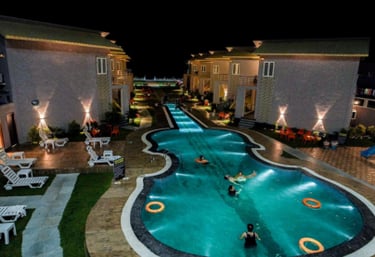 a pool with people swimming in the water