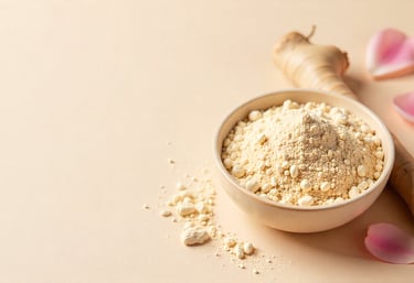 Shatavari roots with beige powder arranged neatly on a soft cream background with subtle pink floral