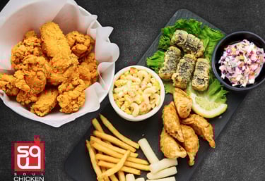 Soul chicken has Fried chicken and sides corn and Mac, Mandoo, Gimmari and coleslaw 