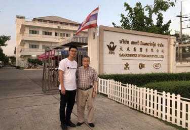 two men standing in front of a sign that says,