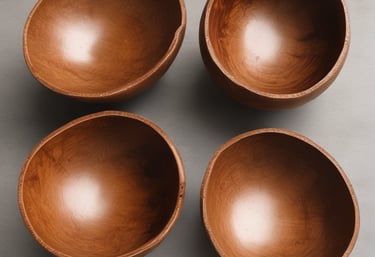 A collection of eco-friendly products displayed on a wooden table surrounded by greenery.